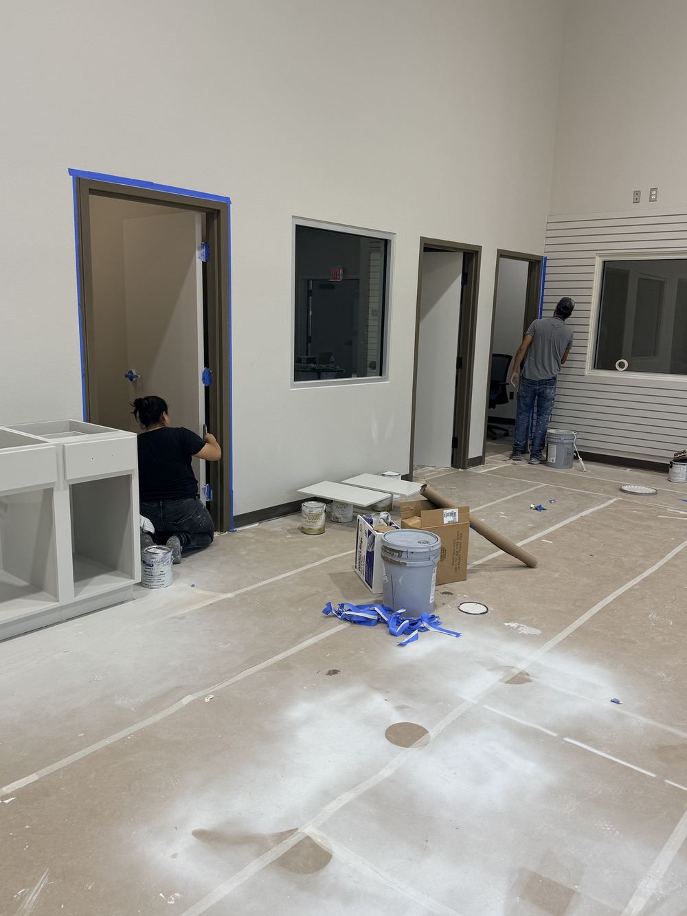 Commercial door frame being installed and finished