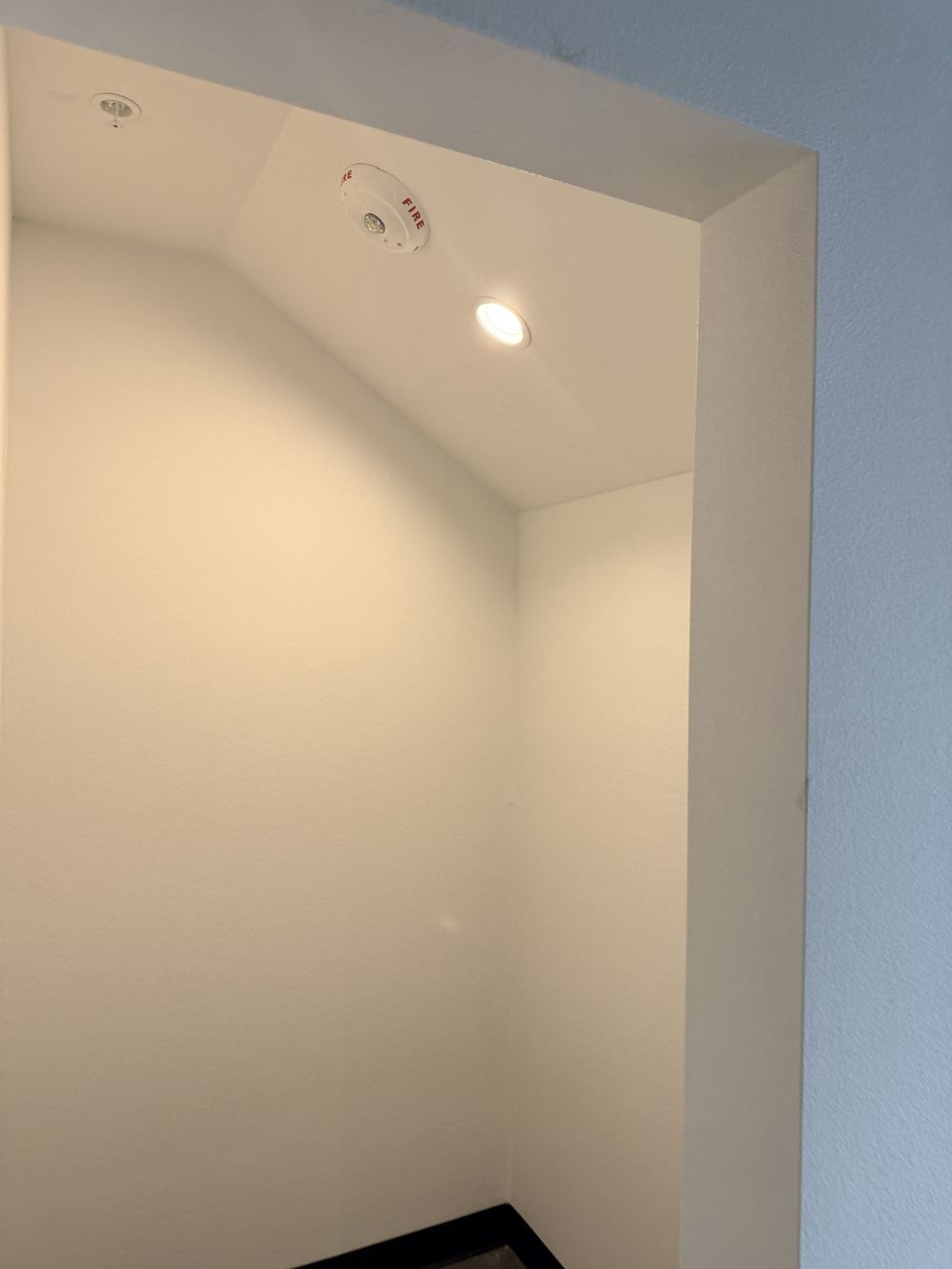 Retail space buildout before painting, exposed brick wall