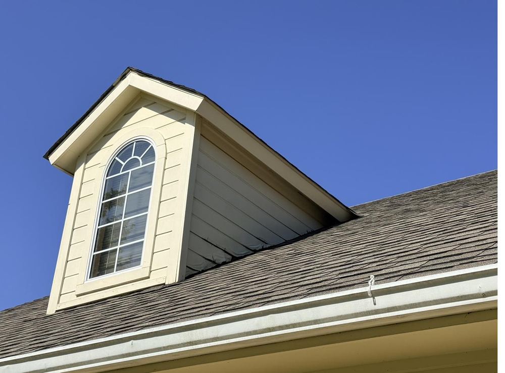 Close-up detail of finished trim and dormer painting
